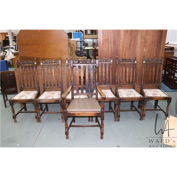 Set of seven matching antique slat back chairs with carved back supports, including six side chairs 