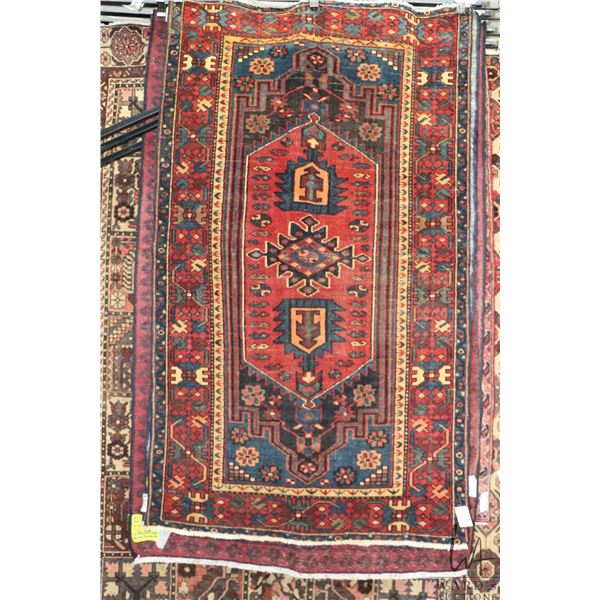 100% hand made Iranian carpet "Zanjan" with red background, center medallion and highlights of blue,