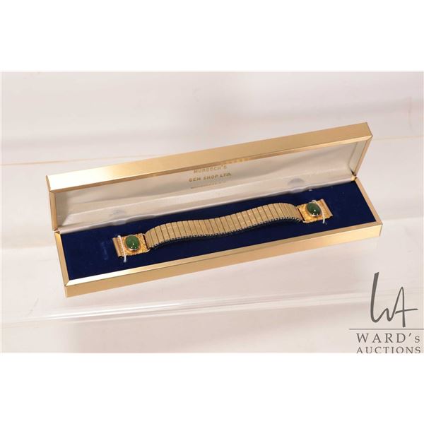 10kt yellow gold end links set with cabochon oval jade gemstones, each end engraved and marked "Yuko