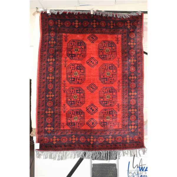 Wool carpet with red background, geometric design and highlights of taupe, blue and brown etc. 58" X