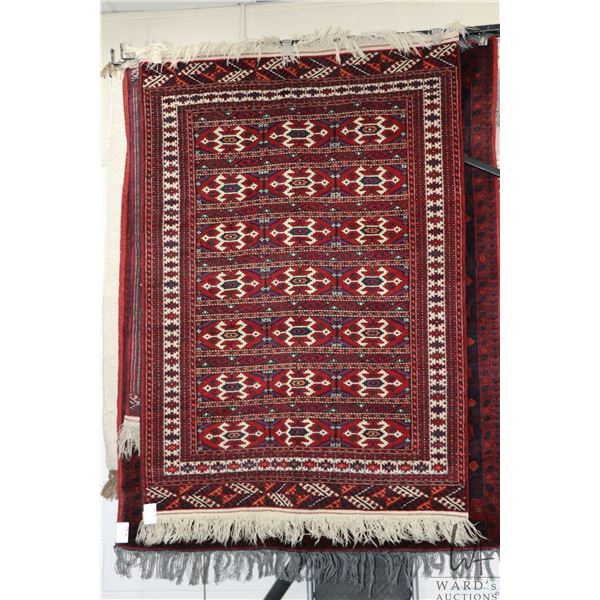 Wool carpet with red background, geometric design and highlights of purple, black and cream etc. 49"