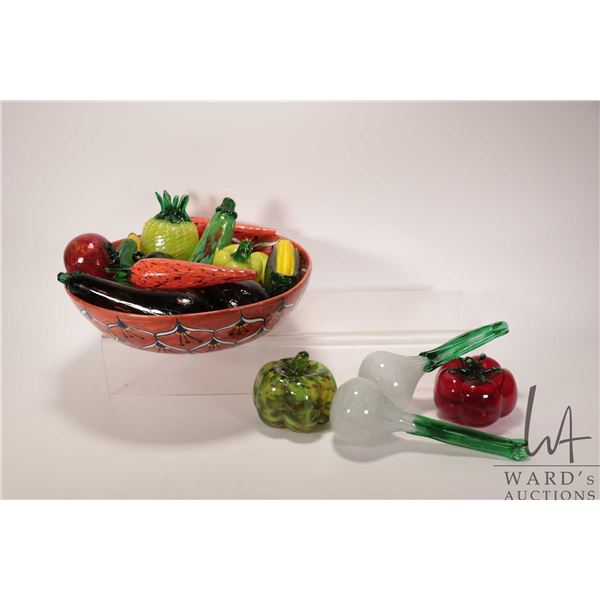 Approx. 19 pieces of hand blown fruit and vegetables and a 15" in diameter Talavera bowl. Note: Not 