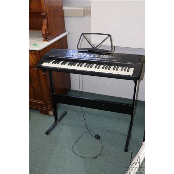 Alesis Melody 61 electronic keyboard on stand, working at time of cataloguing. Note: Not available f