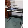Image 1 : Alesis Melody 61 electronic keyboard on stand, working at time of cataloguing. Note: Not available f
