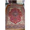Image 1 : 100% hand made Iranian wool carpet "Tabriz" with center medallion, red background and overall floral