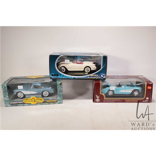 Three boxed 1:18 scale die cast cars including 1953 Corvette, 1957 Corvette and a 1961 Corvette, var