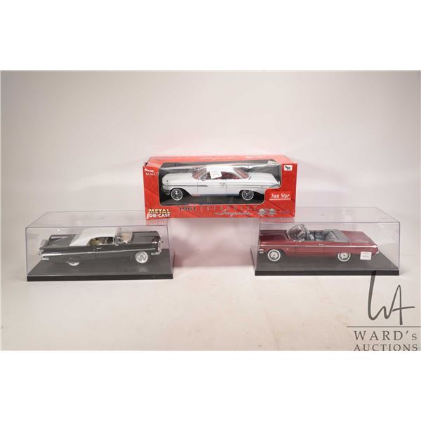 Three 1: 18 scale die cast cars including 1959 Impala, 1961 Impala and a 1964 Impala