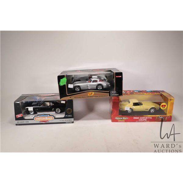 Three boxed1:18 scale die cast cars including Mercedes-Benzs 300 SLR Coupe, 1968 Corvette Coupe and 