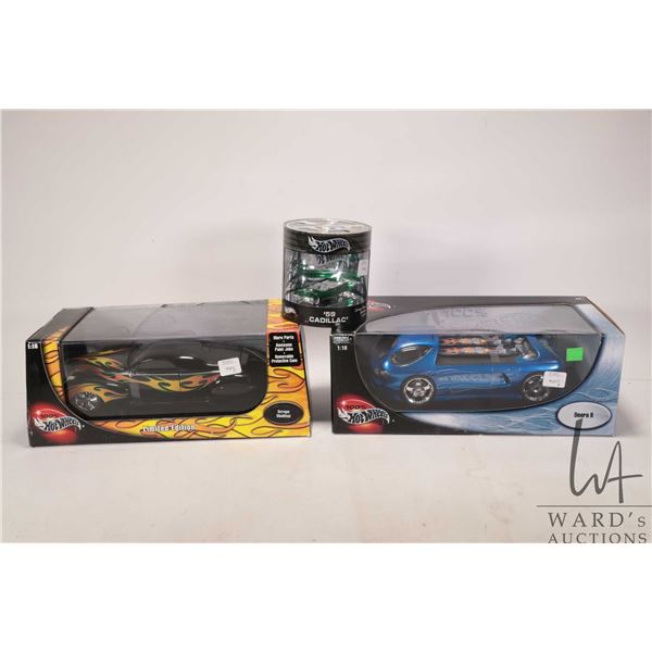 Three die cast Hot Wheels cars including 1: 64 scale 1959 Cadillac, 1:18 scale Deora II and a Scrap 