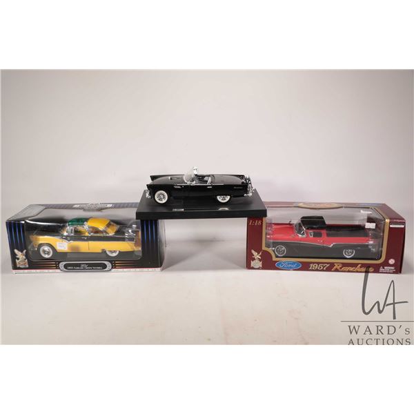 Three 1:18 scale die cast models including 1956 Ford Thunderbird Convertible, 1957 Ford Ranchero and