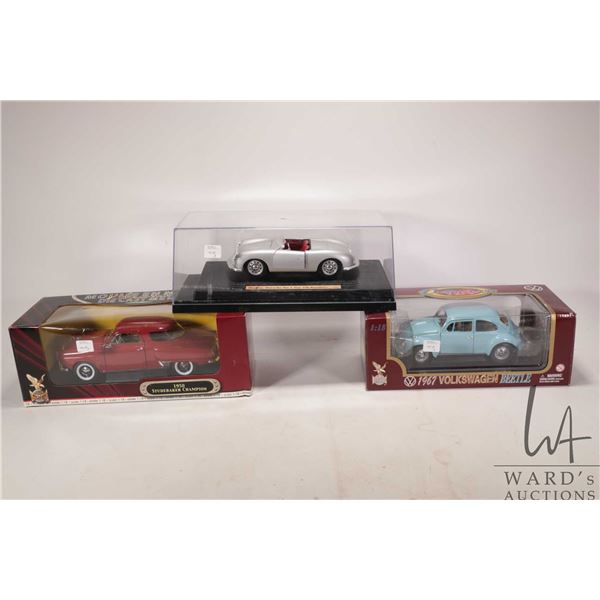 Three 1:18 scale die cast models including 1948 Porche No. 1 Type 356 Roadster, 1967 Volkswagen Beet