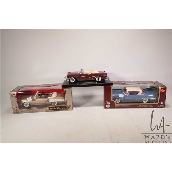 Three 1:18 scale die cast models including 1958 Cadillac Eldorado Seville, 1958 Pontiac Bonneville a