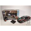 Image 1 : Two remote control vehicles including Ferrari race car and a Harley Davidson fat boy motorcycle, bot