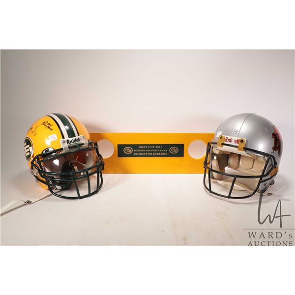 Two CFL football helmets including signed Edmonton Eskimos and a BC Lions