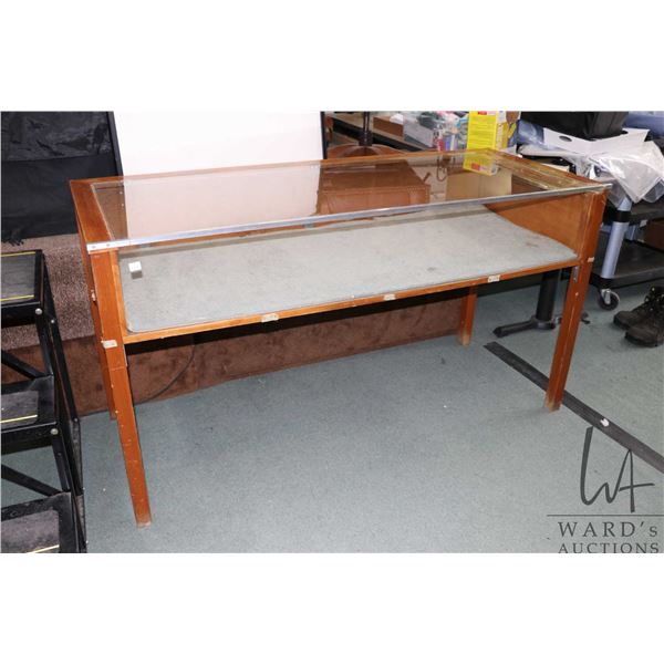 Counter height shallow glass display case with drop down back, 33" H X 60" W X 24" Note: Damage top 
