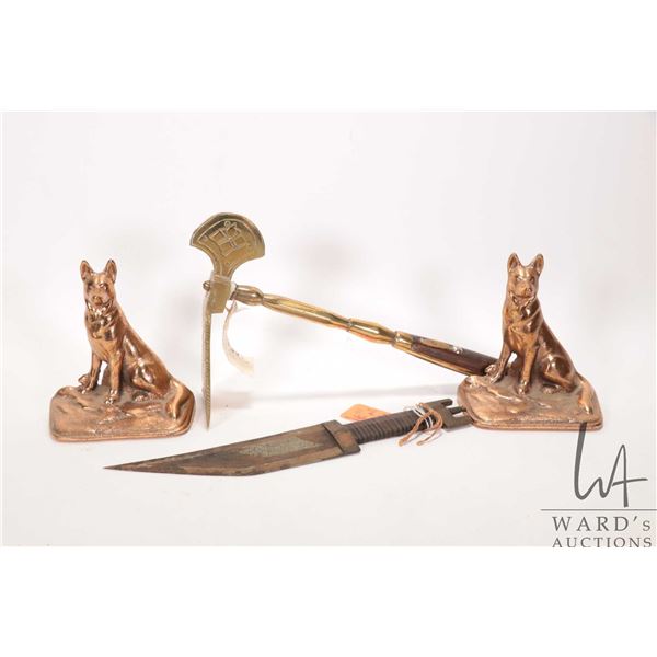 Brass knife labeled " Prod. Afayan or same region" 11" in length and a brass and rosewood Adz, hand 