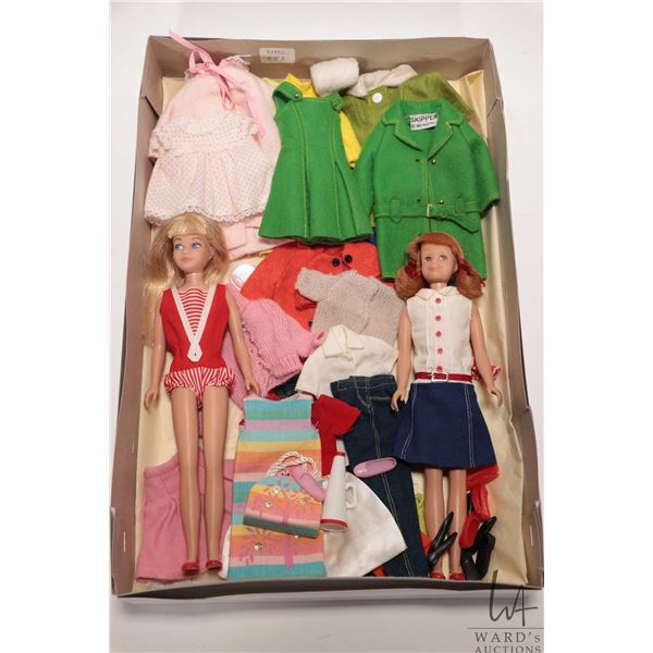Two vintage Barbie dolls including Skipper and Skooter plus a selection of tagged Skipper outfits et