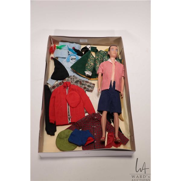 Vintage Barbie Ken doll with a selection of accessories and outfits