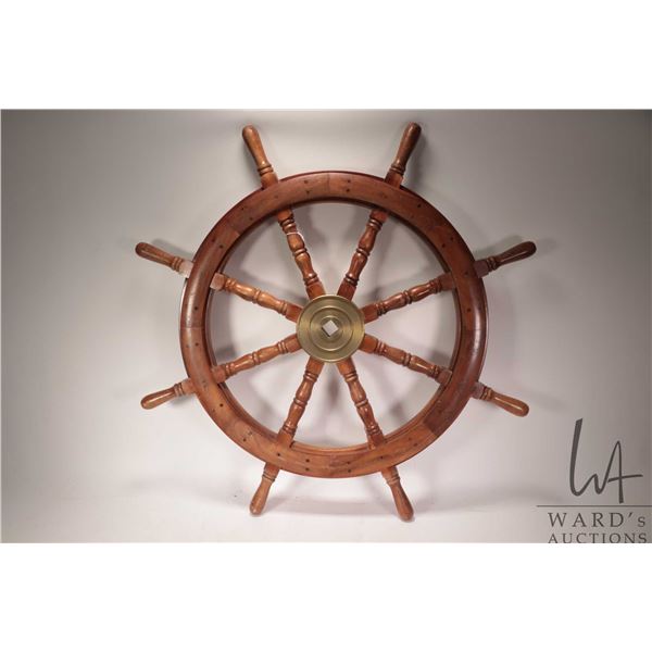 Wooden ship's wheel with brass hub, 36" in diameter. Note: Not available for shipping. Local pickup 