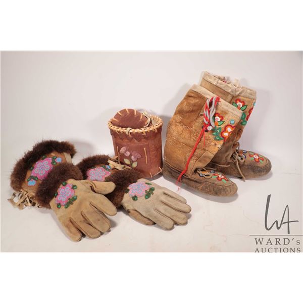 Beaded moccasins, beaded gaunlets with fur and a birch bark basket with tufting