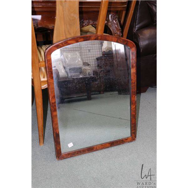 Antique flame mahogany framed mirror Note: used to be attached to a piece of furniture, 26" X 20"