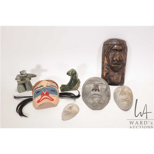 Selection of carved wood and stone masks including west coast painted mask signed Betty Jo, Suquamis