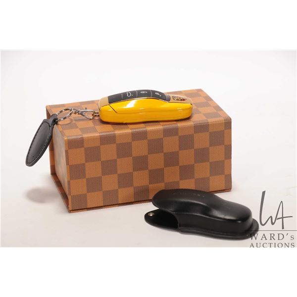 Panamera S Porsche miniature keyfob/ flip phone 3 1/4", two batteries, leather case, charger, and li