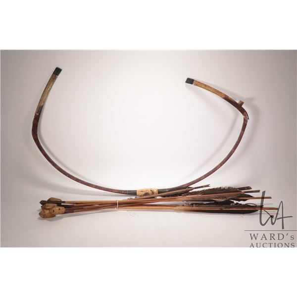 African style re curve bow and seven whistling or warning arrows, note: bow is broken. Note: Not ava