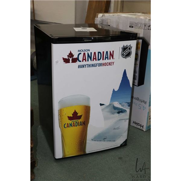 Molson Canadian motif 4.5 cubic ft. refrigerator, appears unused. Note: Not available for shipping. 