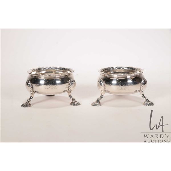 Two sterling clam footed salt cellars, 3 1/2" in diameter and each with British hallmarks