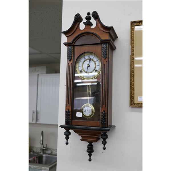Vienna regulator style chiming wall clock made by Spirit, 26" in height. Note: Not available for shi