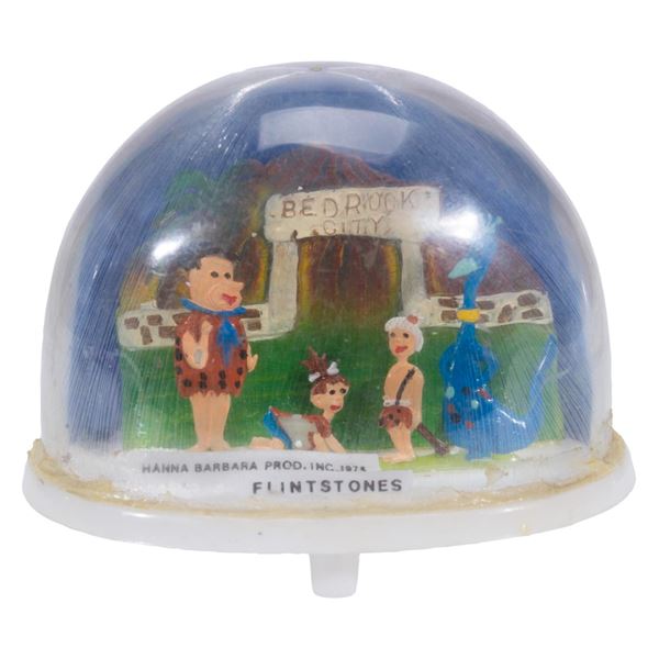 A Flintstones Bedrock City Souvenir Snow Globe.
