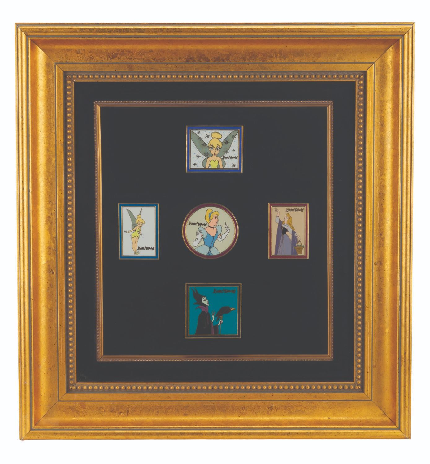 A Disney Auctions Marc Davis Signature Series Oversize Pin Set.