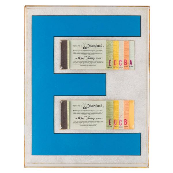 A Pair of Disneyland Ticket Books in Acrylic Frame.
