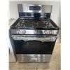Image 2 : GE Stainless Steel Gas Range with 5 Burners and Oven (PARTS FOR STOVE INSIDE) (SEE DAMAGE ON BOTTOM)