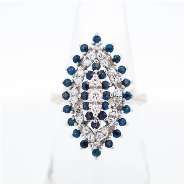 Estate 14K white gold ladies diamond and sapphire ballerina ring.