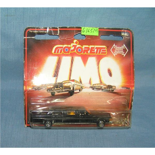Vintage cast metal stretch limo toy mint on card
