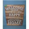 Image 1 : Welcome to our comfortable and happy home sign