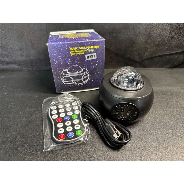 1 Mini Music Star Projector with Remote and App Control - New