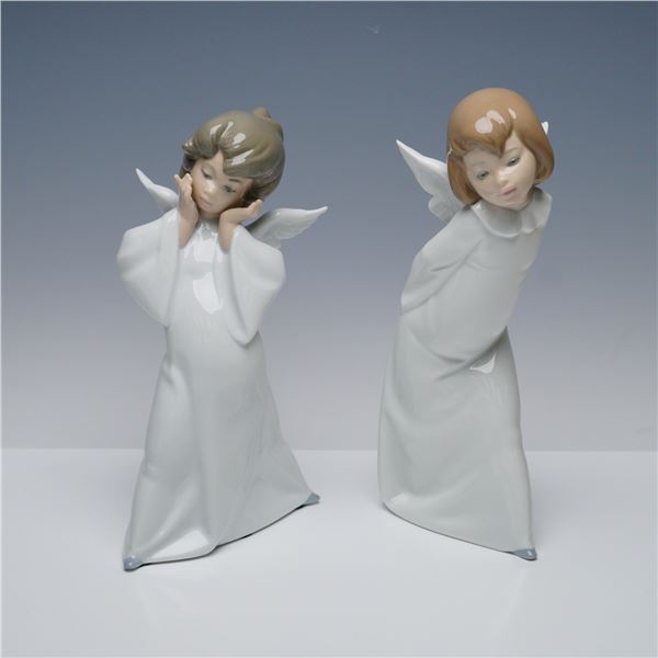 Pair of Lladro Figurines, Cherub Puzzled and Cherub Smiling