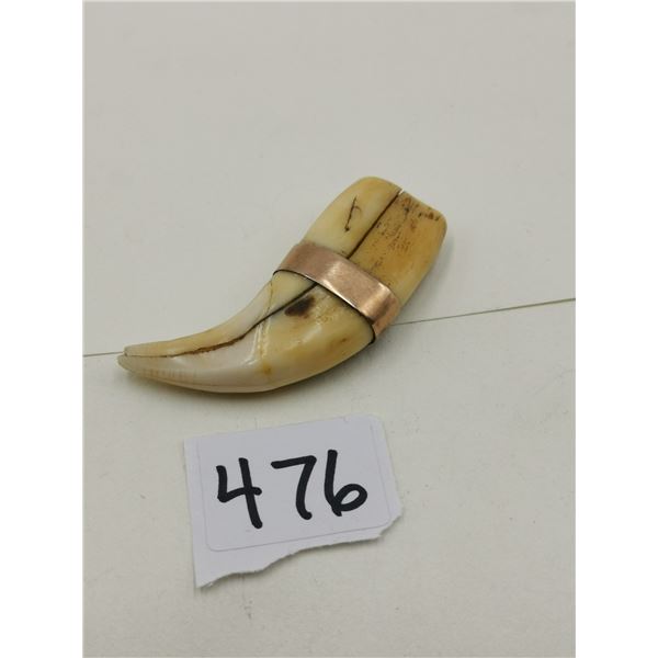 Bear? Claw with golden ring