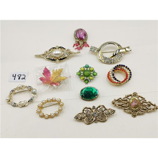 Eleven vintage broaches