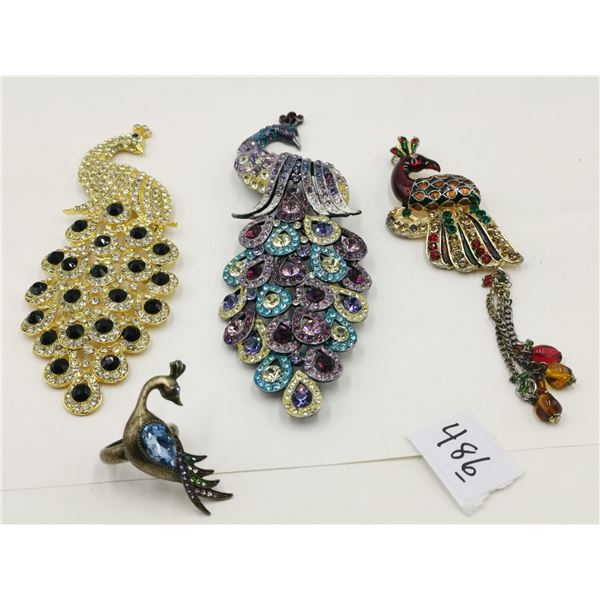 Four peacock broaches