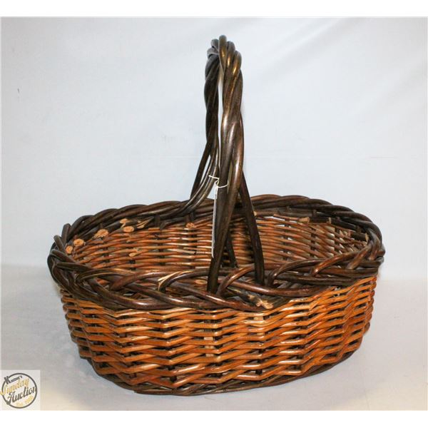 LARGE WICKER BASKET. 19” LONG X 15” WIDE