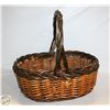Image 1 : LARGE WICKER BASKET. 19” LONG X 15” WIDE