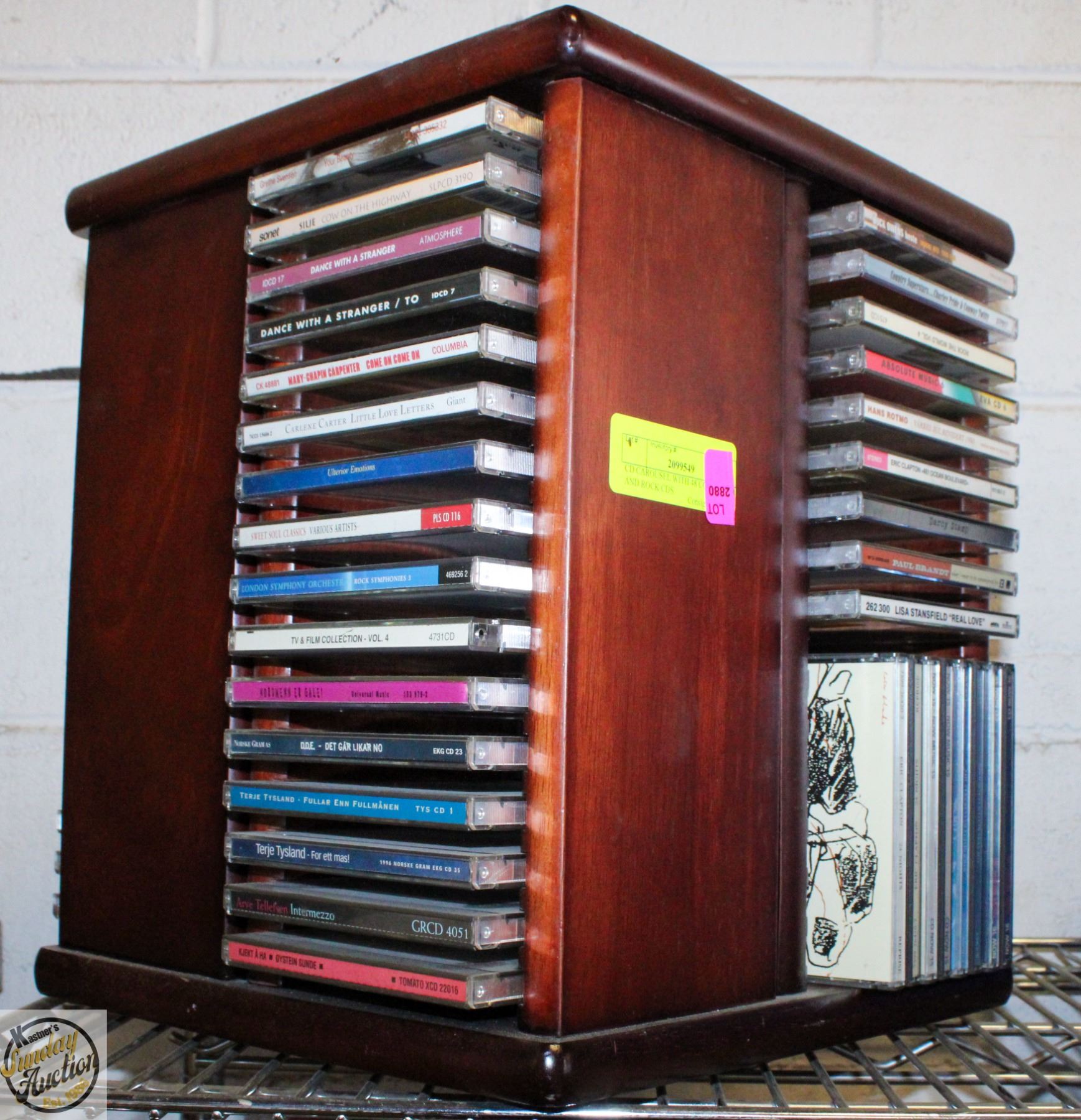 CD CAROUSEL WITH 48 COUNTRY AND ROCK CDS