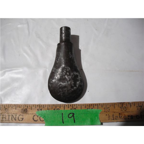 Vintage muzzle loader shot flask with black powder pellets