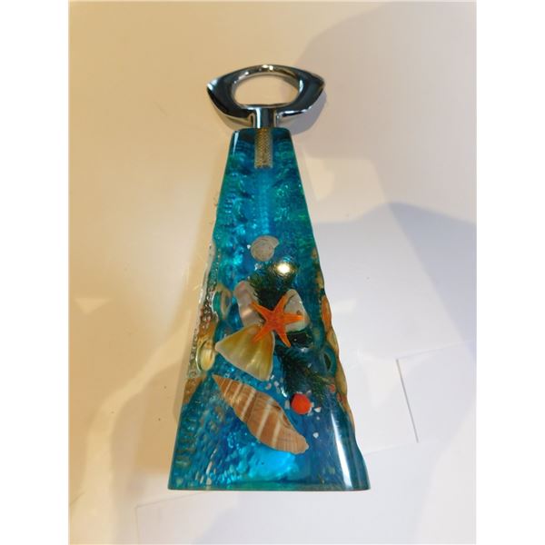 422.  LUCITE BOTTLE OPENER