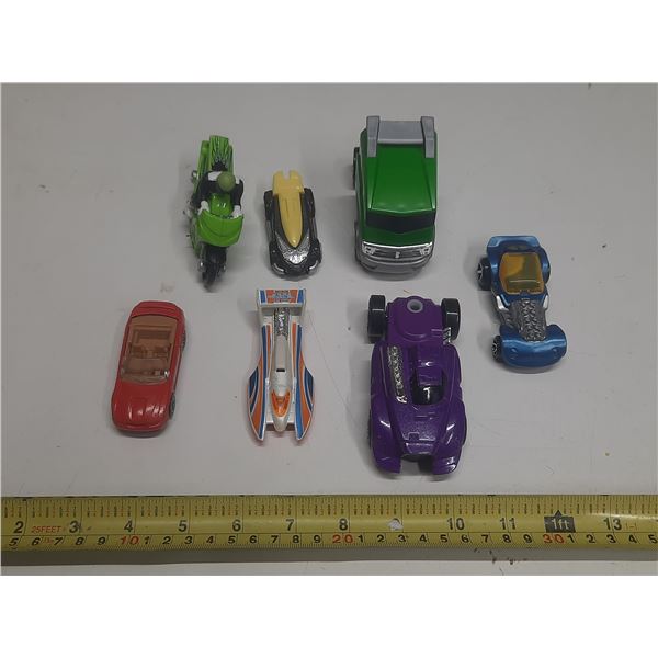 (7) Hot Wheel Cars.