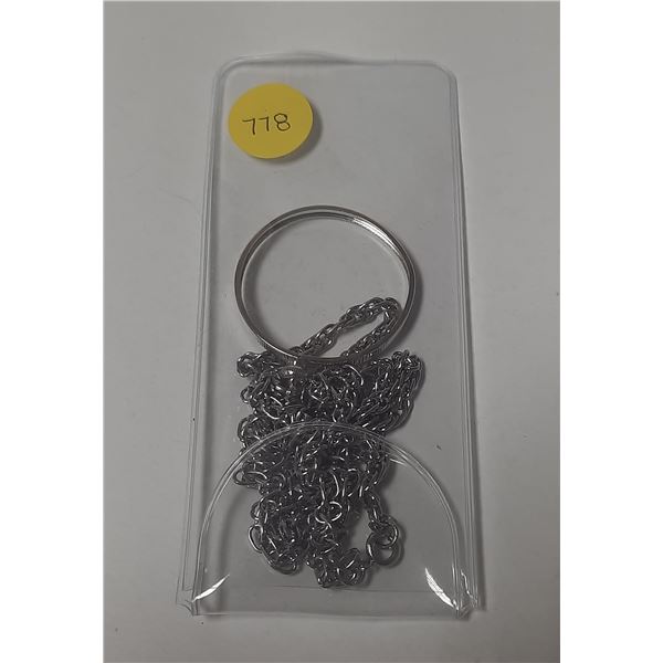 Bezel and chain to hang a Canadian Silver Dollar around your neck.